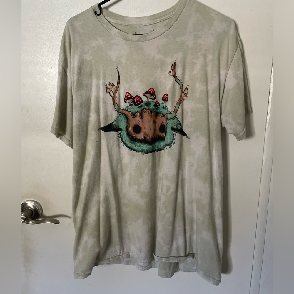 Shirt with a cartoon and mushroom